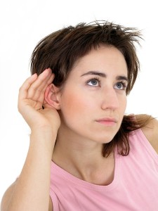 bigstockphoto_Woman_With_Hand_To_Ear_Listeni_209983